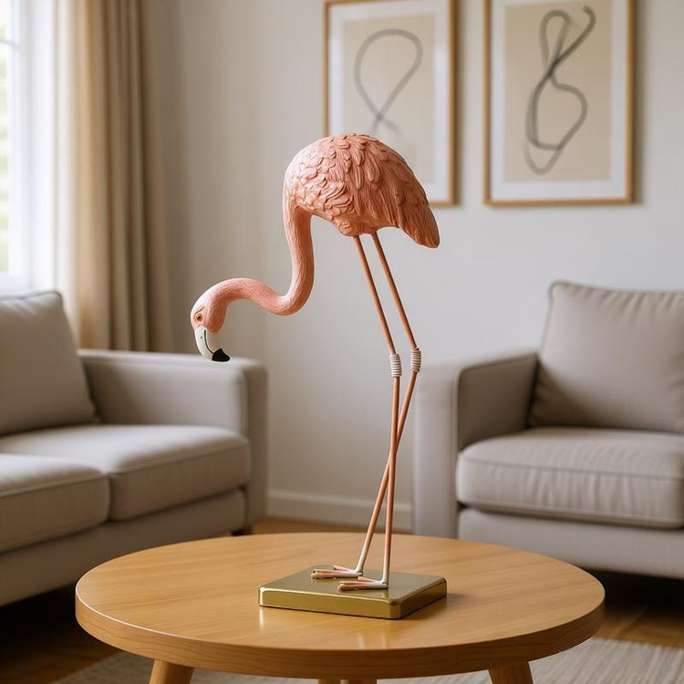 Pink flamingo ornament on a gold-coloured stand in a living-room setting.