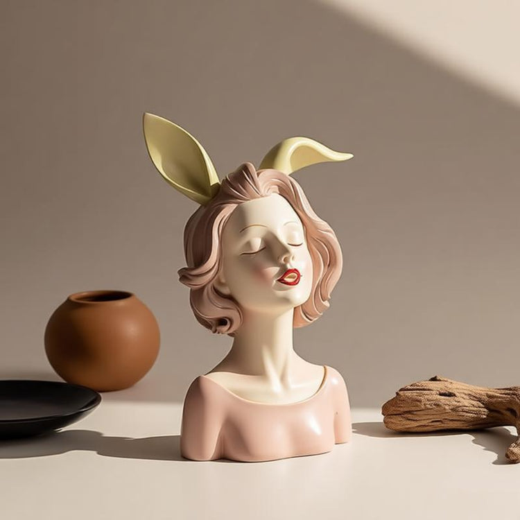 Decorative girl bust with gold-coloured rabbit-ear details.