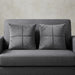 Two silver grey cushion covers with geometric panel stitching on a grey sofa.