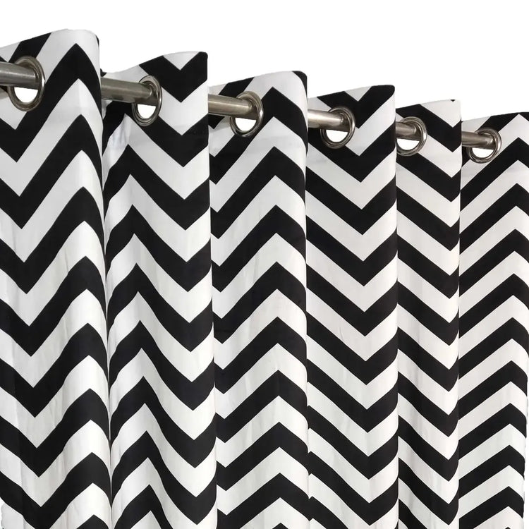 Close-up of black and white chevron curtains and metal eyelets.