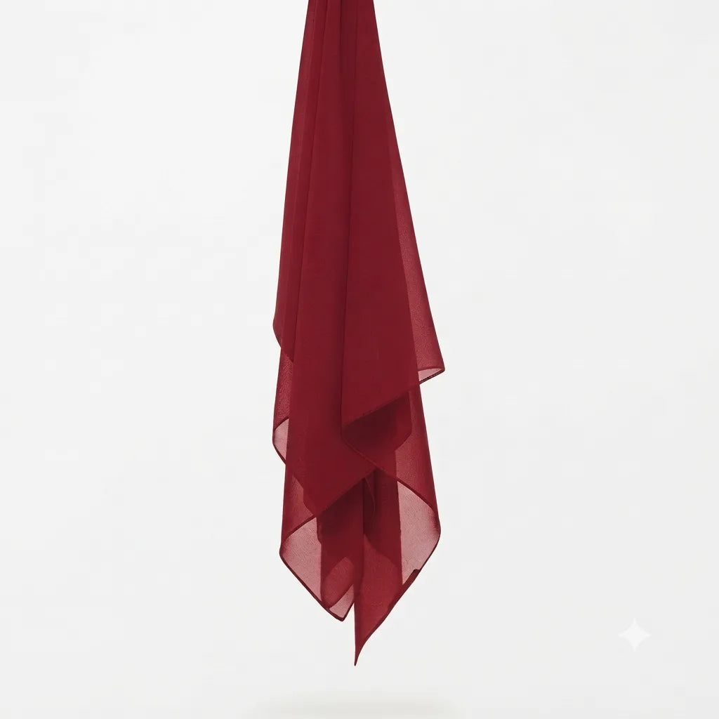 Burgundy chiffon stole hanging vertically to show its light fabric.