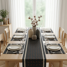 Black patterned table runner with matching placemats.