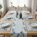 Pale blue and cream floral table runner with matching placemats.