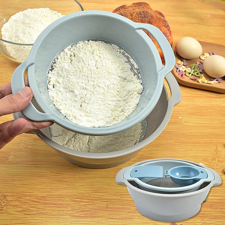 Grey-blue flour sieve held over a matching mixing bowl with flour inside.