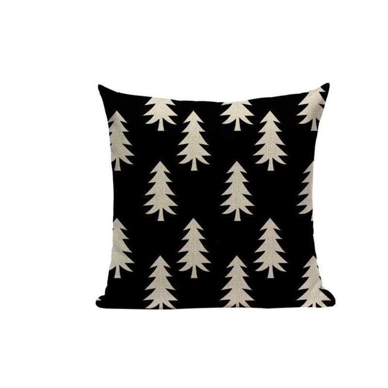 Black cushion cover with rows of cream fir trees.