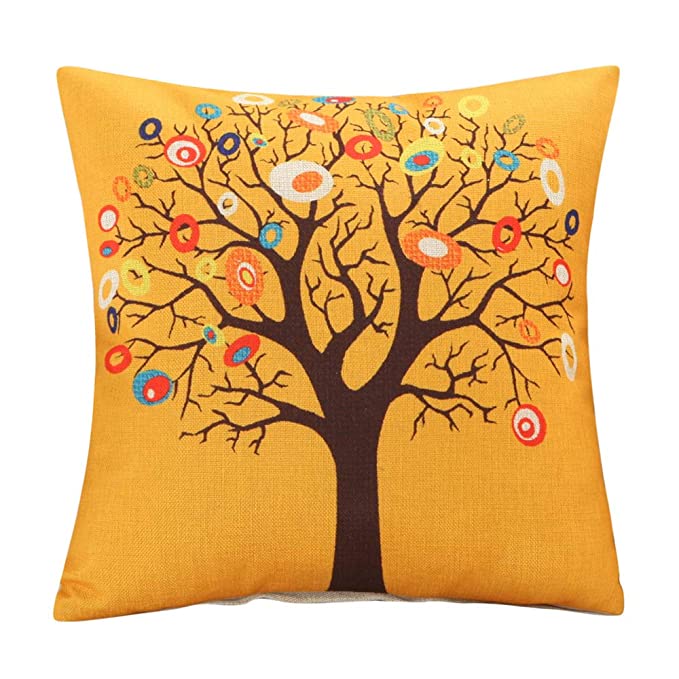 Yellow cushion cover with a brown tree and colourful circular leaves.