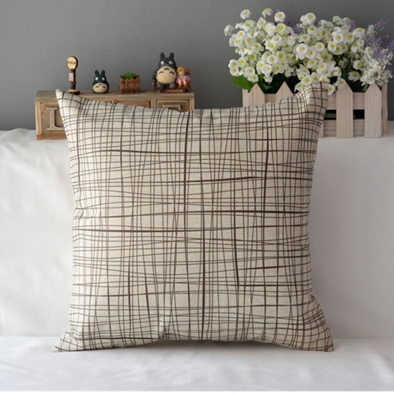 Cream cushion cover with a grey crosshatch check pattern.