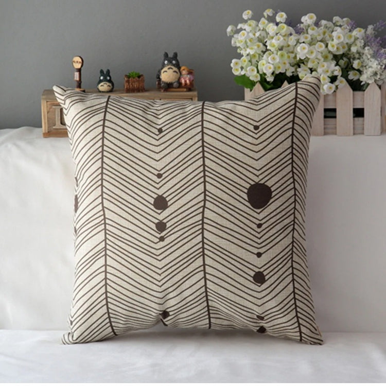 Cream cushion cover with grey chevrons and small heart motifs.