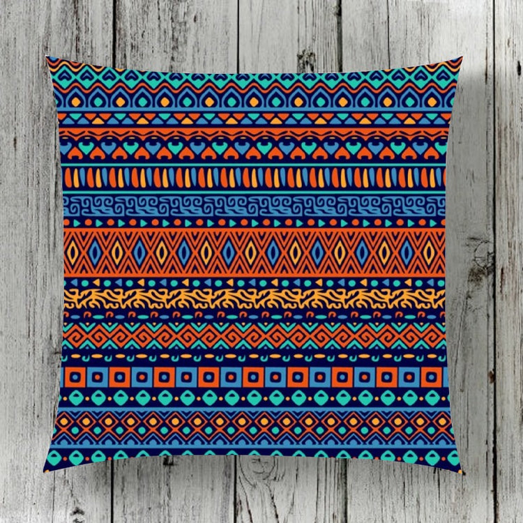 Cushion cover with narrow horizontal bands of colourful geometric motifs.