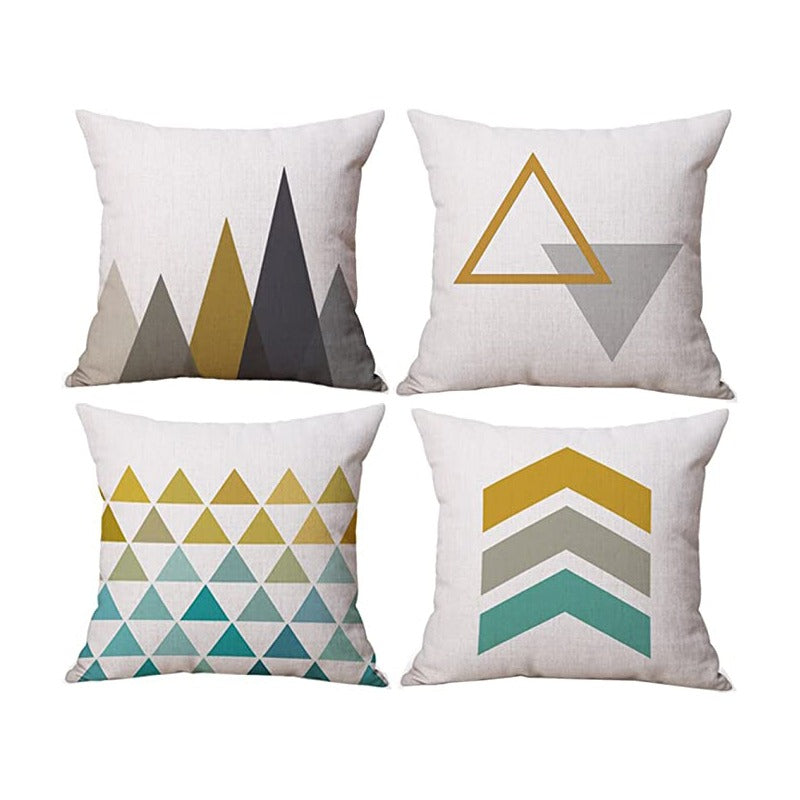 Four cream cushion covers with mustard, grey and teal triangle and chevron patterns.