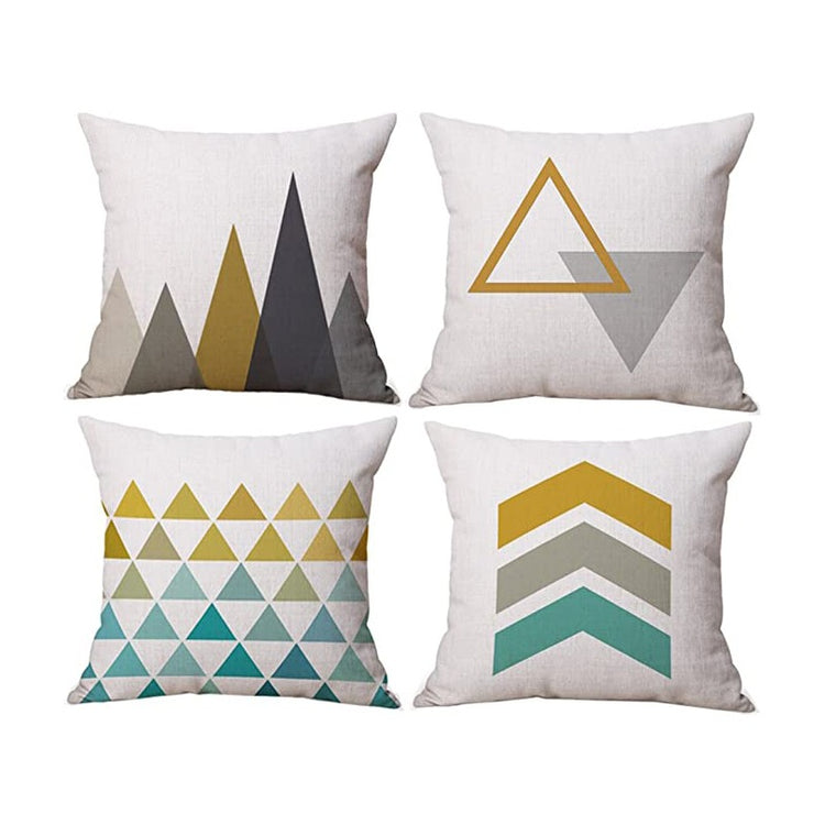 Four cream cushion covers with mustard, grey and teal triangle and chevron patterns.