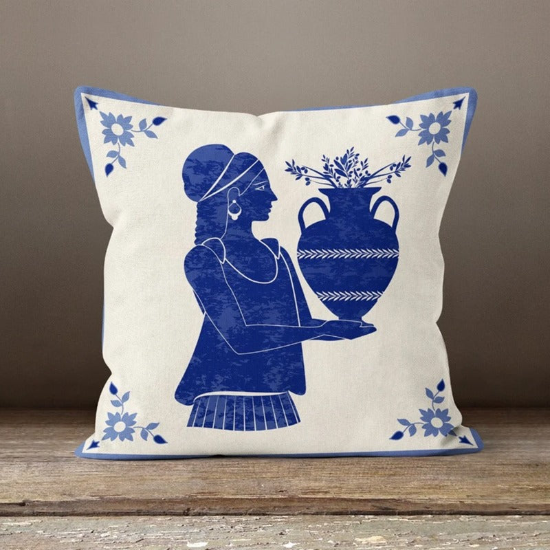 Cream cushion cover with a blue figure holding a large pot.