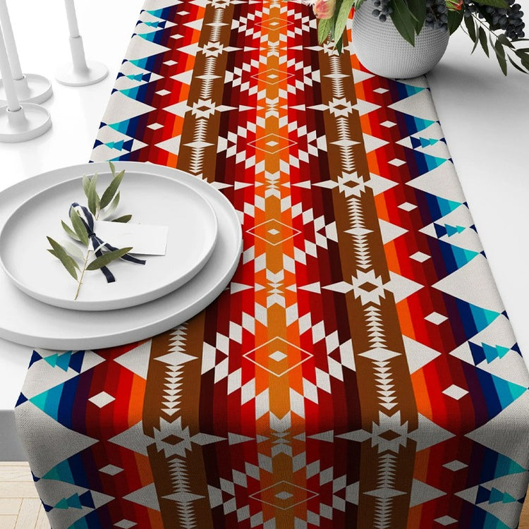 Red and orange geometric table runner with turquoise accents.