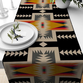 Black and beige geometric table runner with multicoloured diamond motifs.