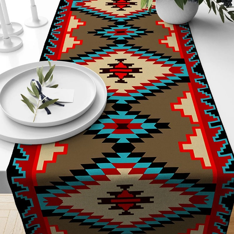 Red, turquoise and beige geometric table runner with diamond motifs.