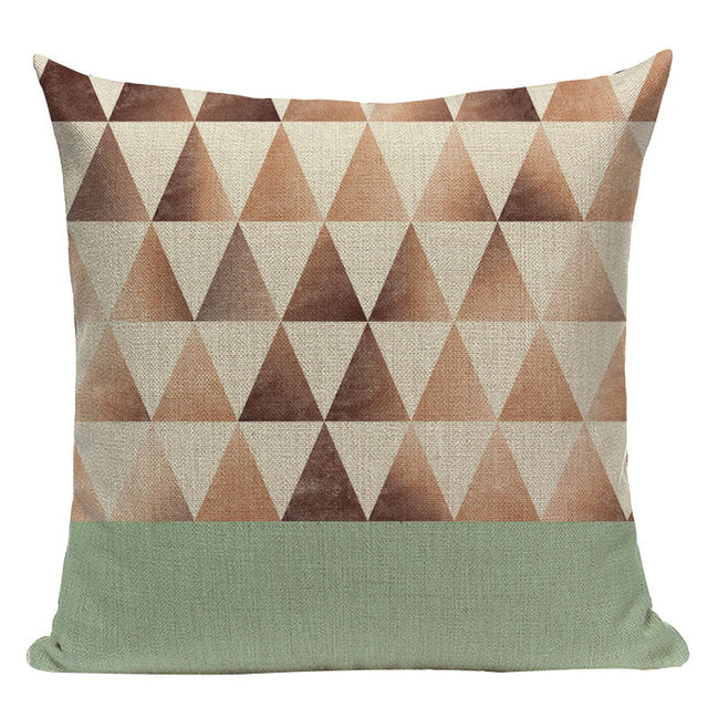 Cushion cover with small brown and cream triangles above a mint green band.