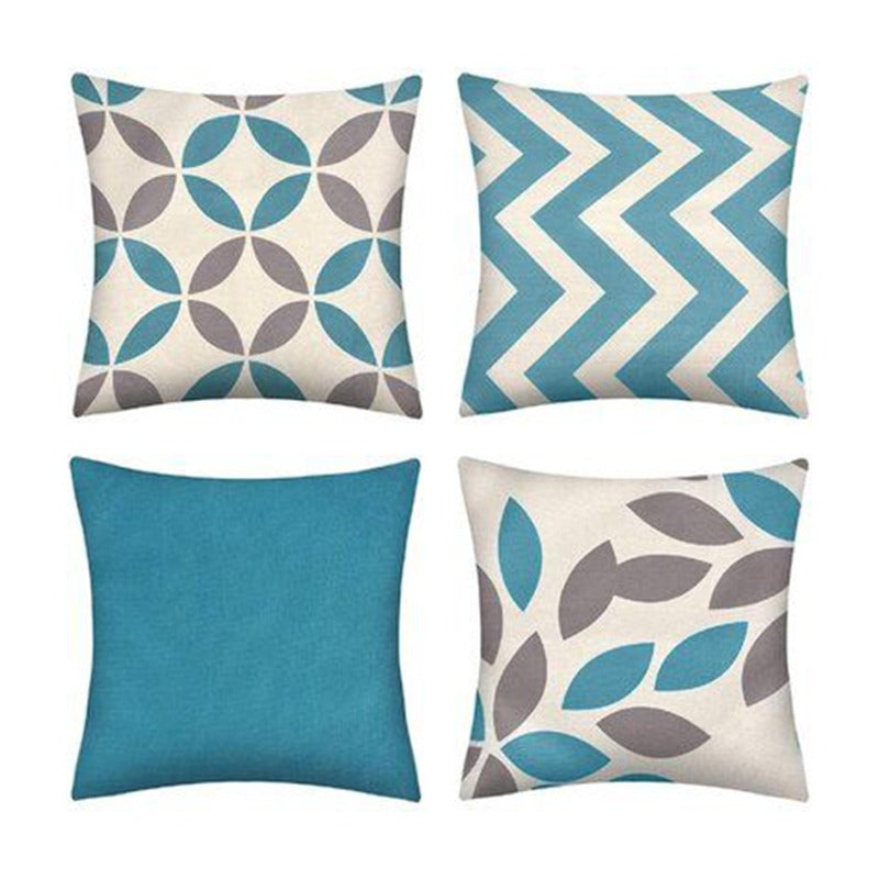 A set of four cushion covers with different patterns including solid color, geometric, and leaf prints.
