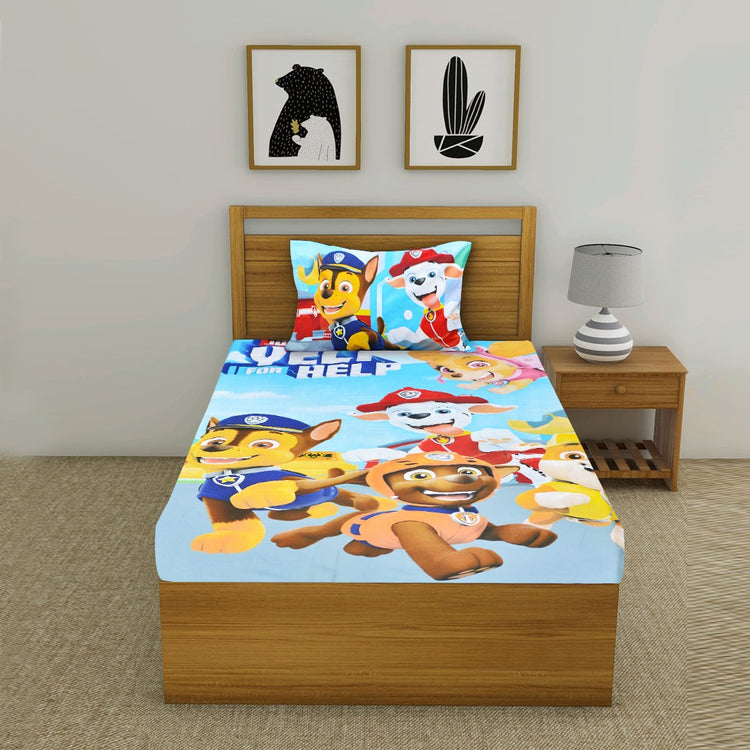 Colourful cartoon-print children's bedsheet and matching pillowcase displayed on a single bed.