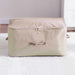 Beige zippered fabric storage bag with side handles.