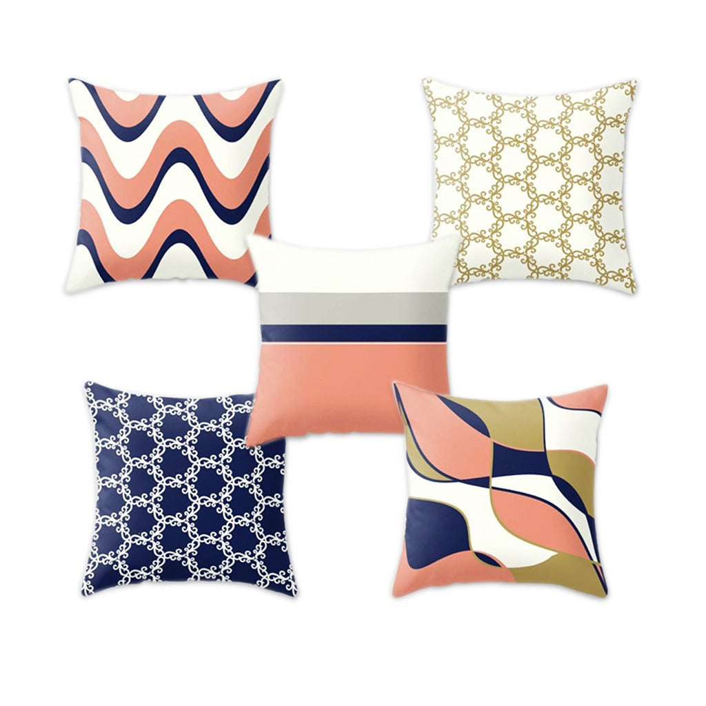 Five assorted cushion covers with geometric, floral and colour-block patterns.