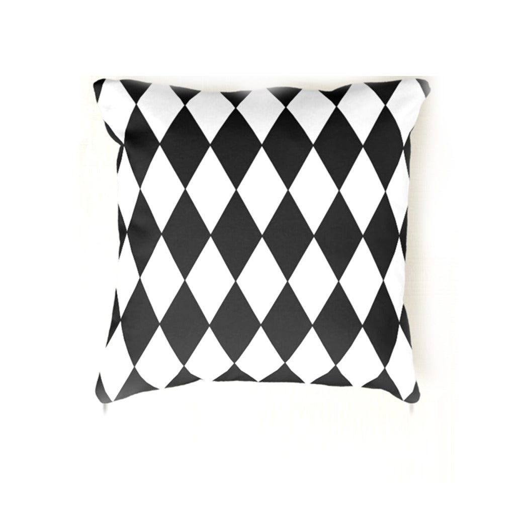 Black and white harlequin diamond-pattern cushion cover.
