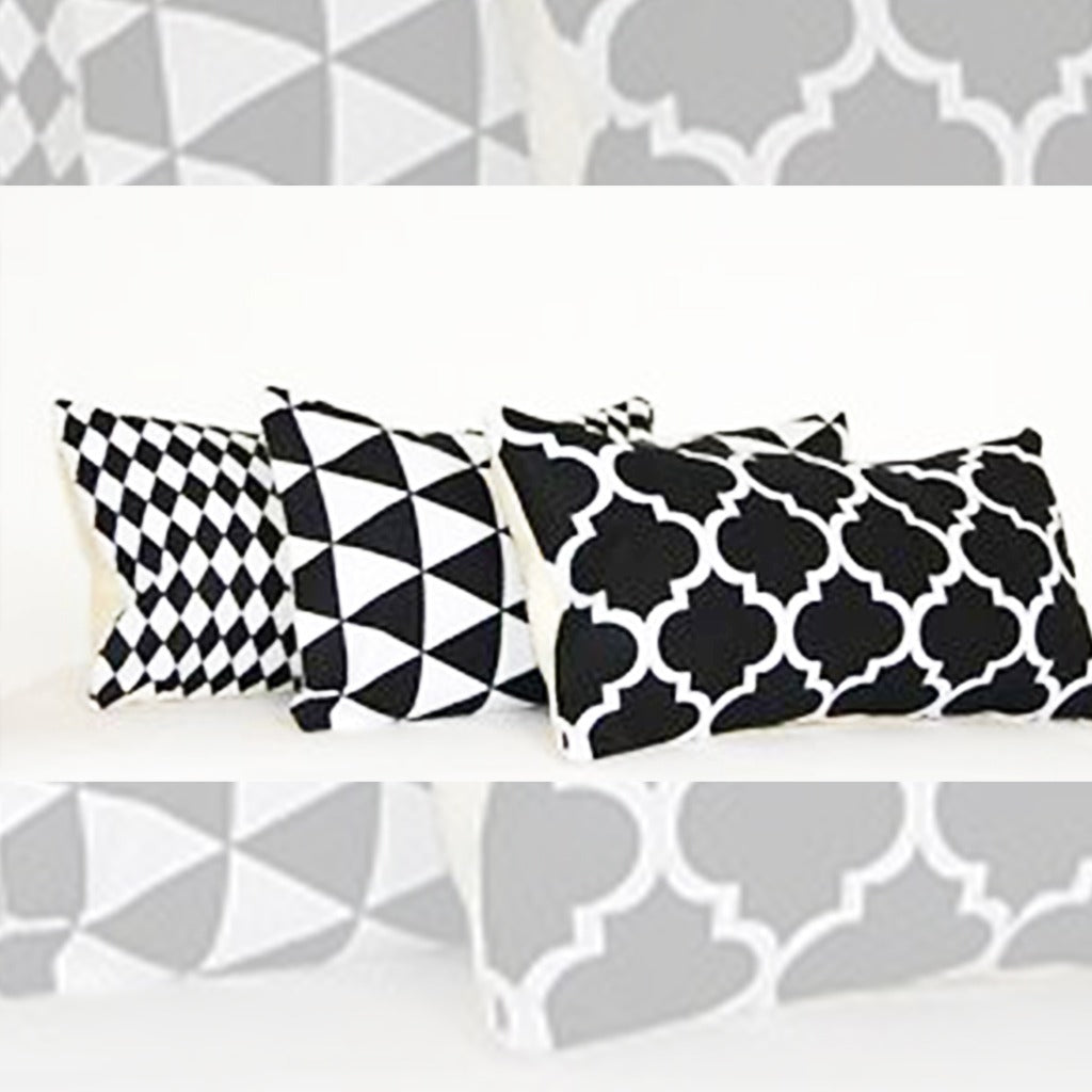 Black and white geometric cushion-cover designs shown together with grey pattern samples.