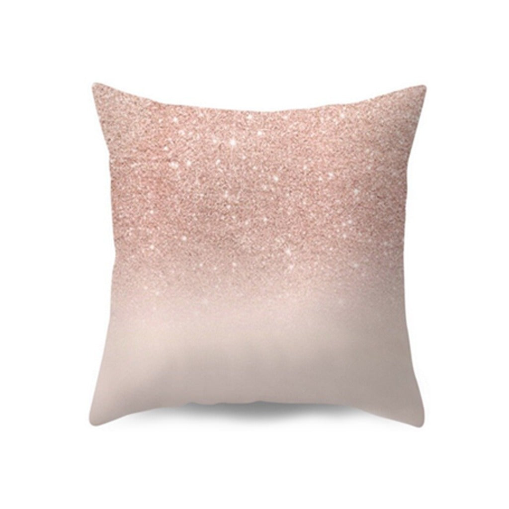 Cushion cover with a pink glitter-style print fading into cream.