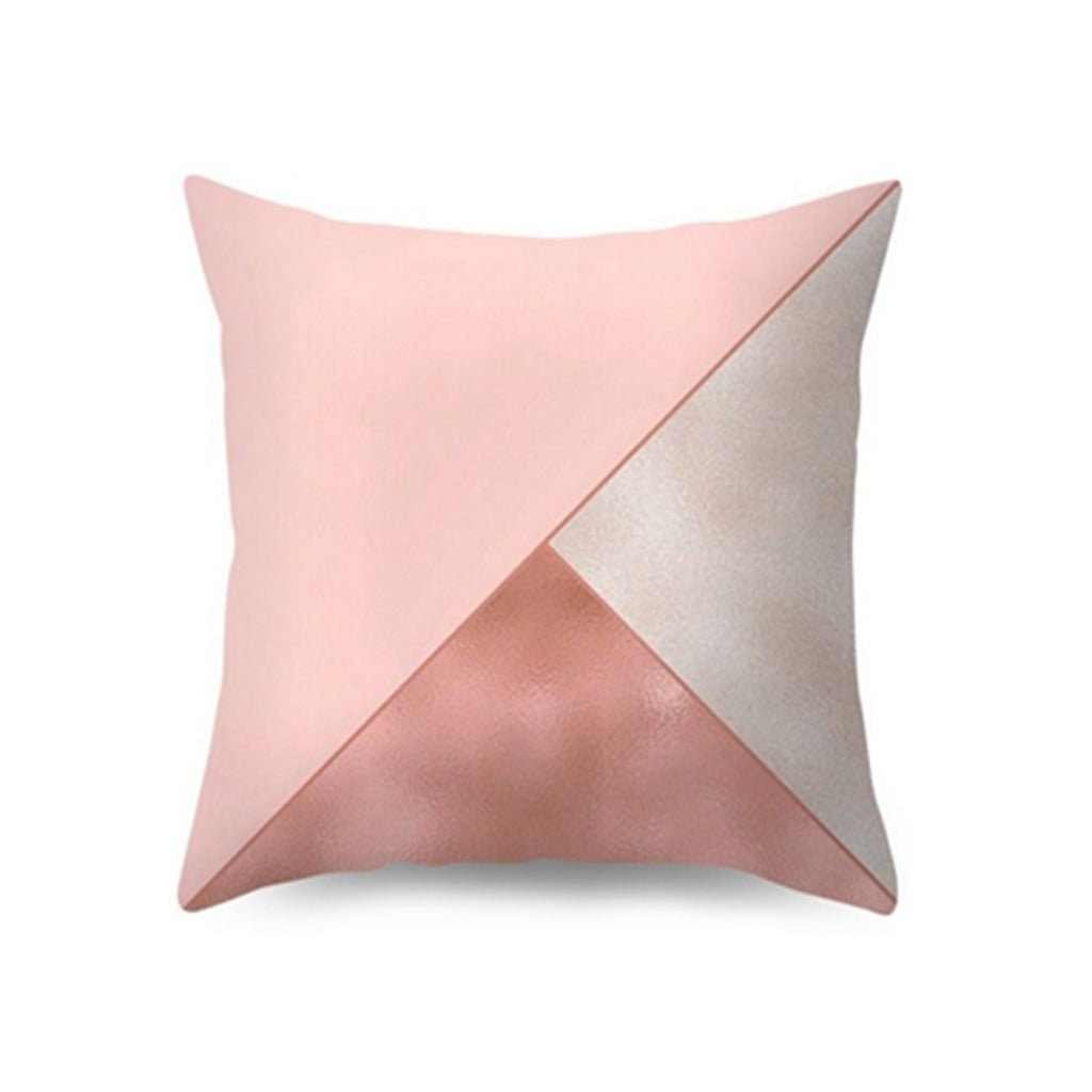 Cushion cover with blush pink, cream and rose-toned geometric panels.