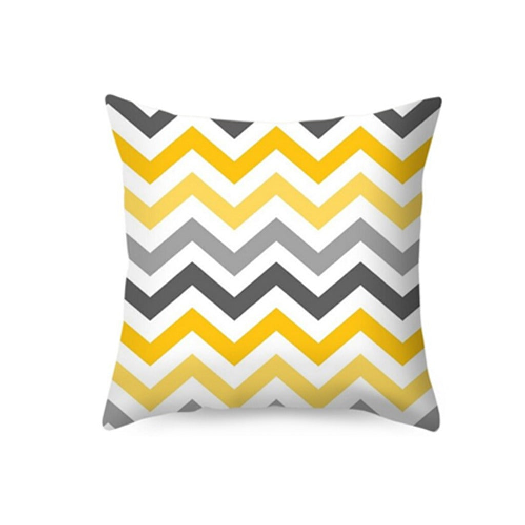 Cushion cover with yellow, grey and white chevrons.