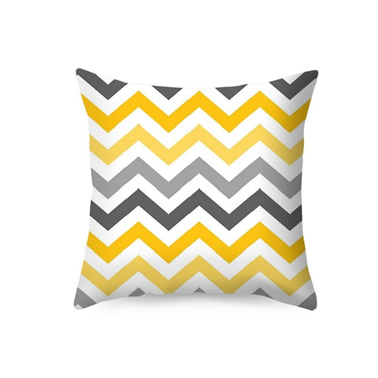 Cushion cover with yellow, grey and white chevrons.