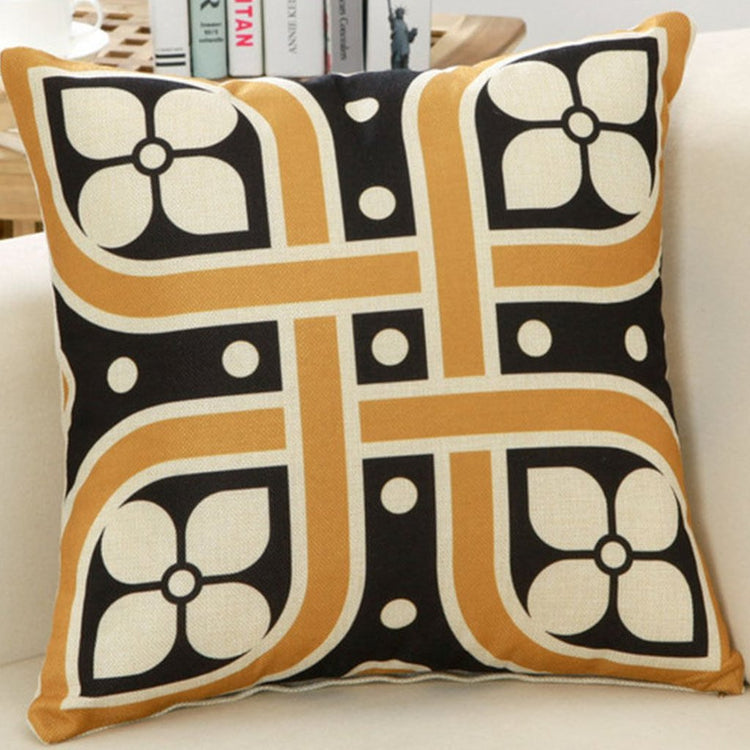 Black, cream and gold cushion cover with floral tiles and geometric bands.