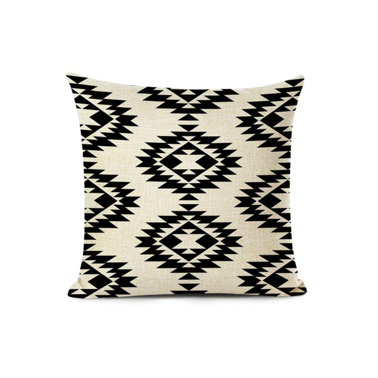 Cream cushion cover with black stepped geometric diamond motifs.