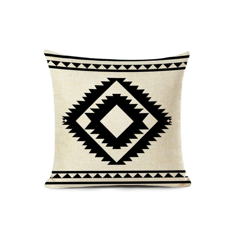 Cream cushion cover with a large central black geometric diamond.