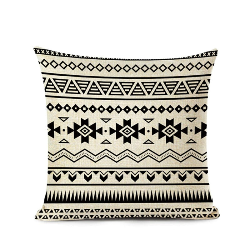 Cream cushion cover with horizontal bands of black geometric motifs.
