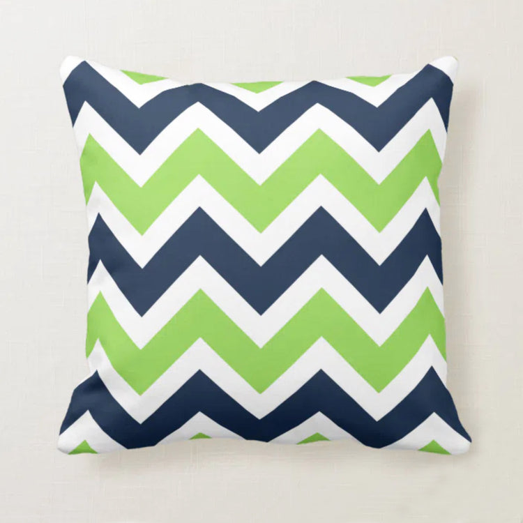 Cushion cover with navy, green and white chevrons.