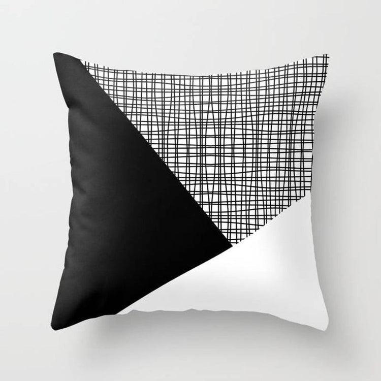 Cushion cover with black and white panels and a fine grey checked section.