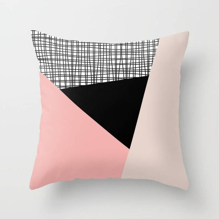 Cushion cover with blush, black and cream panels and a grey checked section.