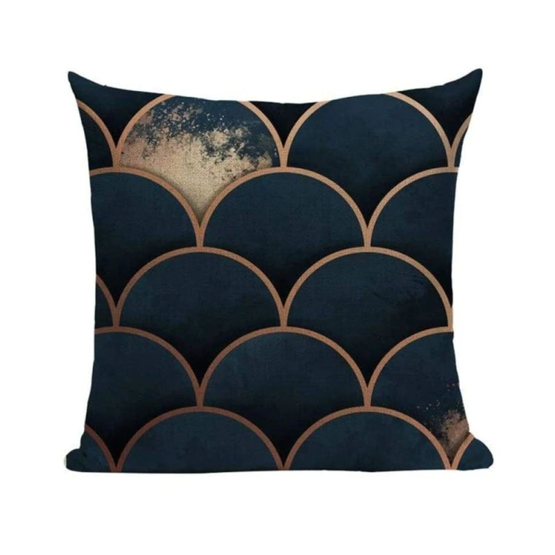 Dark blue cushion cover with bronze-coloured scallop outlines.