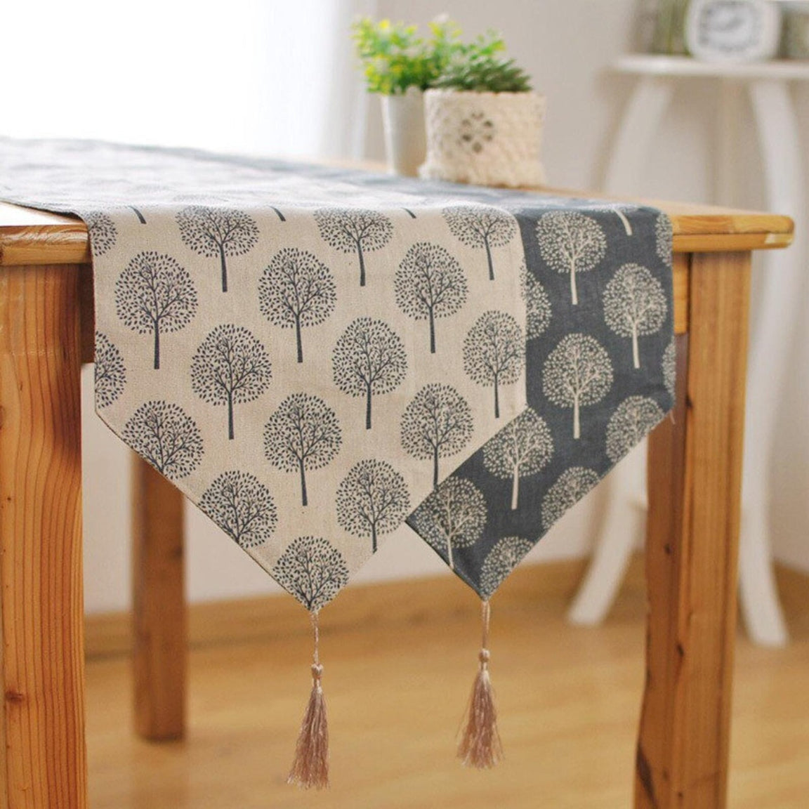 Tree-pattern table runner showing contrasting light and dark fabric panels.