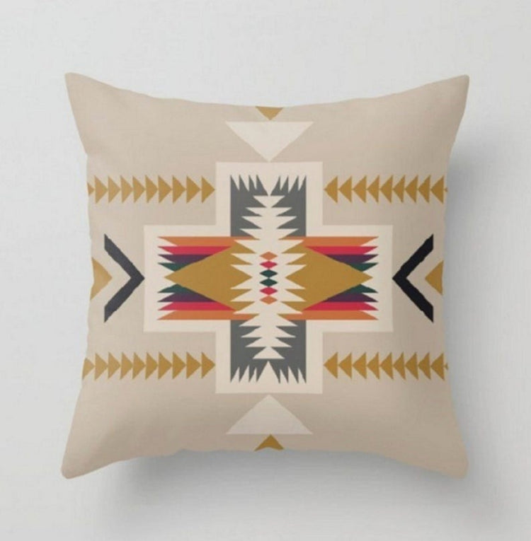Beige cushion cover with a large multicoloured geometric star motif.