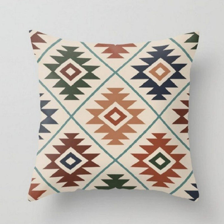 Cream cushion cover with multicoloured stepped diamond motifs.