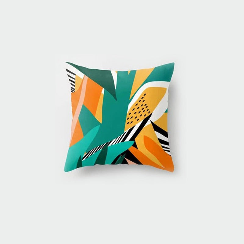 Cushion cover with bold teal, yellow, orange and black botanical shapes.