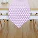 Lavender and white triangle-pattern table runner.