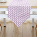 Lavender table runner with white chevron lines.