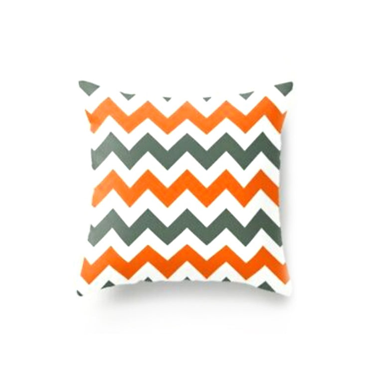 Cushion cover with orange, grey and white zigzag stripes.