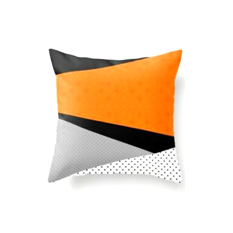 Cushion cover with diagonal orange, grey, black and white colour blocks.