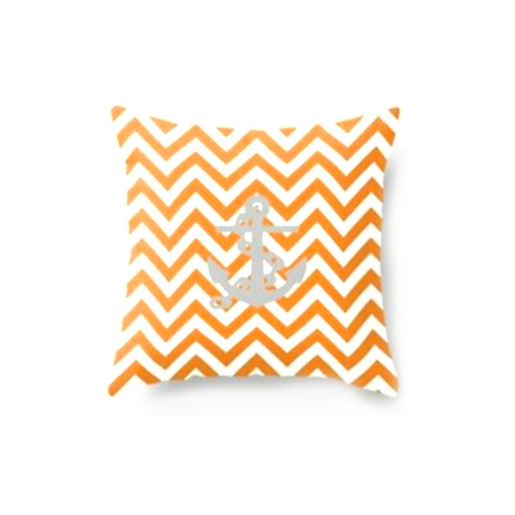 Cushion cover with orange and white zigzag stripes.