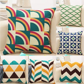 Six cushion covers with colourful geometric patterns.