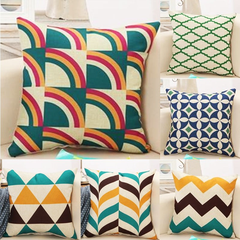Six cushion covers with colourful geometric patterns.
