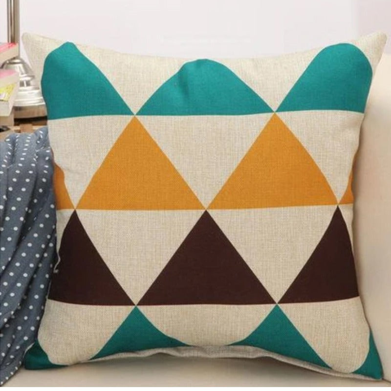 Cushion cover with teal, mustard, brown and cream triangles.